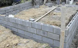 Professionals building a foundation with blocks in Santa Ana, CA