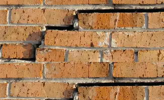 Brick wall with serious structural damage in Santa Ana, CA